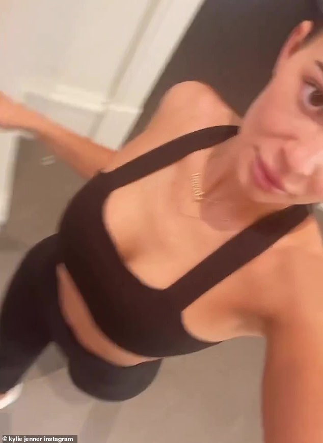 Working out: The Kardashians reality star wore a sports bra and a pair of leggings in a new clip shared on her Instagram Story