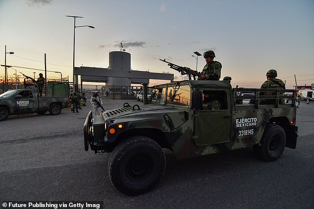 The Mexican Army accompanied by the National Guard protects the Federal Center for Social Readaptation after Ovidio Guzmán was transferred there by military helicopter