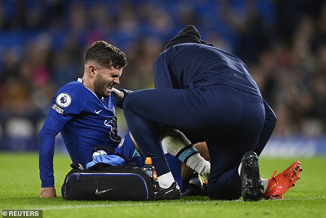 Christian Pulisic (left) also left the field against Man City after a hard challenge from John Stones.