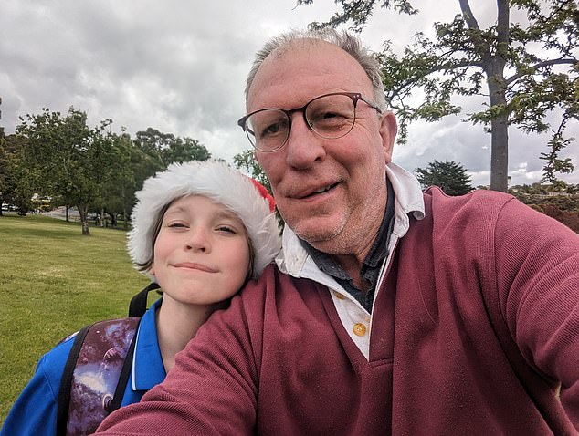 Cancer survivor Bruce Lund also faces a bleak outlook after he was evicted from his Hobart residence for being seven days late with his rent (Mr Lund pictured with his 10-year-old son, Heath)