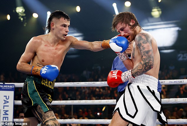 Until last year, Garside had seven Australian boxing national championships to his name.  Pictured fighting Layton McFerran during King of the Castle Fight Night