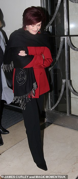 Designer Wardrobe: Sharon looked chic as always in a Chanel scarf, red coat, and black pants