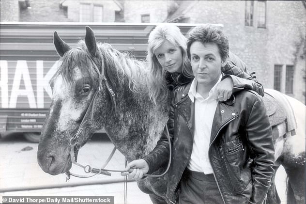 Memories: Among the photos of the late musician and photographer and her rock star husband on display at Abbey Road Studios is one of Linda leading a pony across the famous zebra crossing outside.