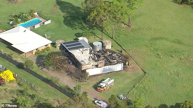 Detectives are still investigating the cause of the fire and a potential motive for its deliberate igniting (burned-out shed on property pictured)