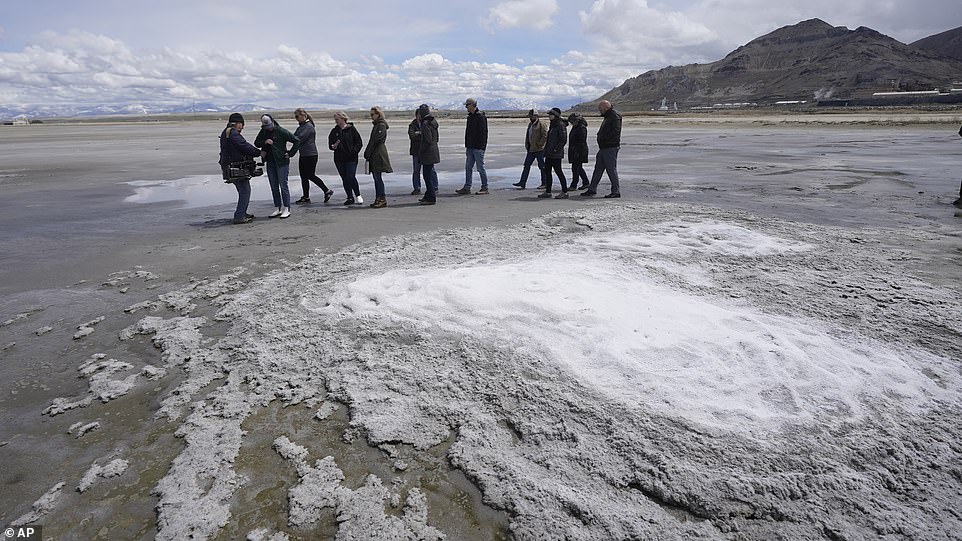 Pictured: Utah legislators and DNR chiefs walk past a Mirabilite spring while surveying the lake in May.