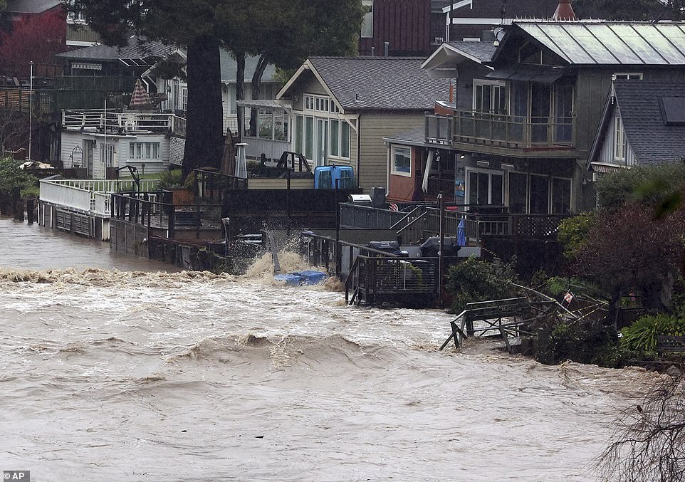 Massive flooding of dilapidated homes in Soquel Creek in Capitola, California.  This is the second major storm to hit the state since New Years