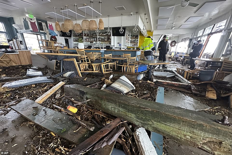 The Zelda restaurants had a mountain of debris in their dining rooms after the ocean surge pushed it through the window and front wall.