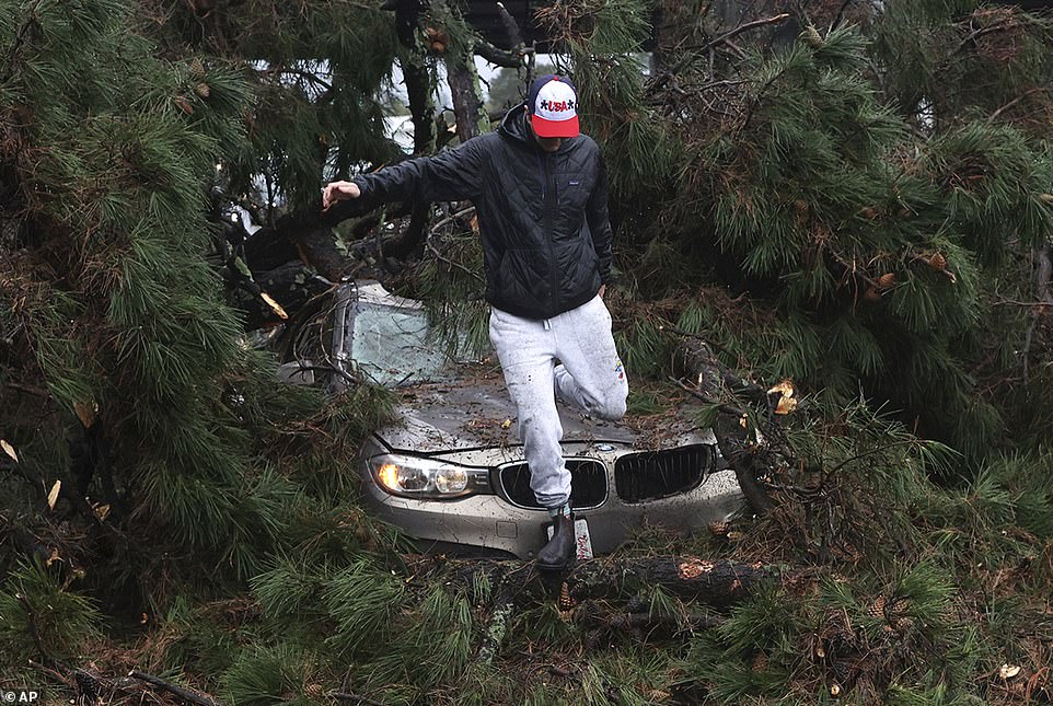 A man jumped out of his car after sliding through trees on Thursday.  He did not suffer any injuries