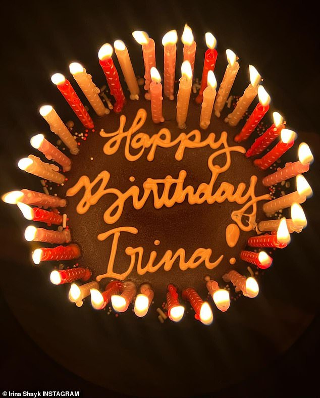 Hmm!  The Sports Illustrated cover girl also shared a photo of her birthday cake, lit with candles.