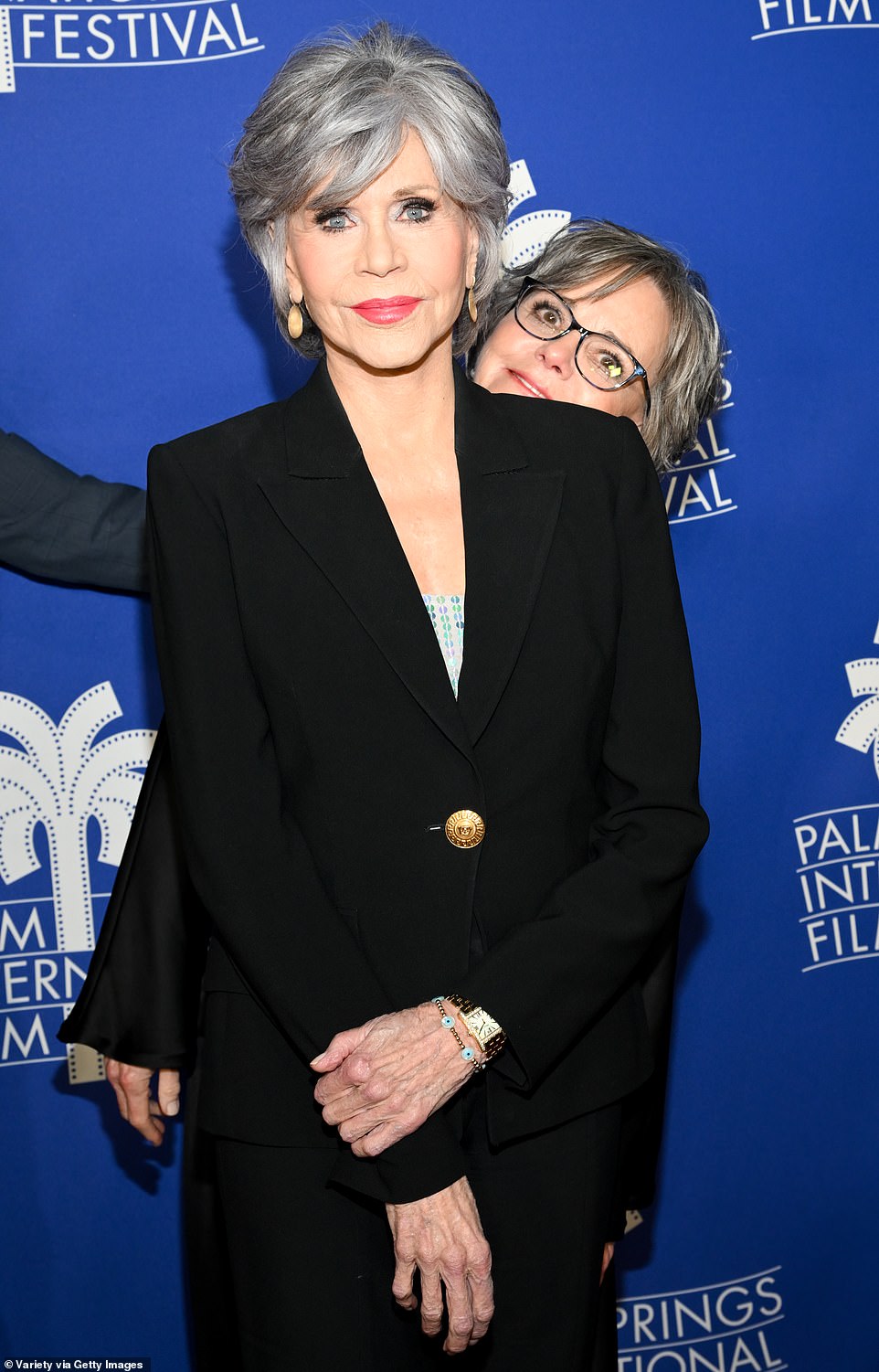 Epic: Jane was bombarded by one of her illustrious co-stars when the one and only Sally Field struck a goofy pose behind the Klute star at one point on the red carpet.