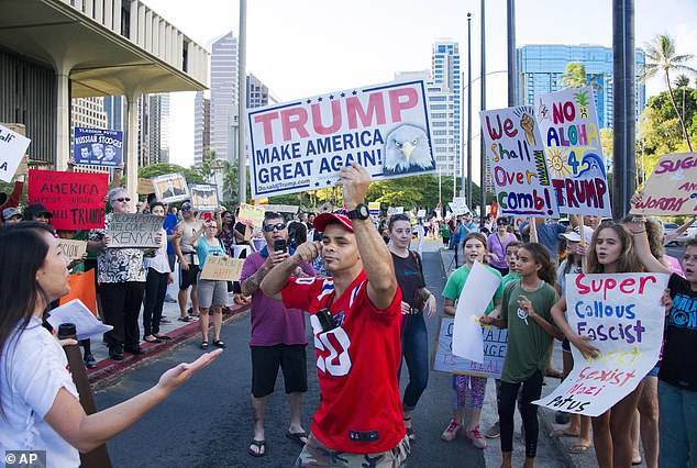 Odquina (pictured in red) sued the city to revoke his license plates on multiple occasions.  The city of Honolulu countersued and won, as a judge ruled that Odquina had no constitutional right to blasphemy.  He has appealed the decision, despite the fact that his plates were reportedly stolen on December 26.