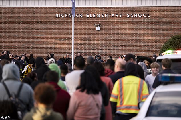 A crowd of parents waited outside Richneck Elementary School after the 2 p.m. shooting where a six-year-old boy allegedly shot his teacher on purpose after a 