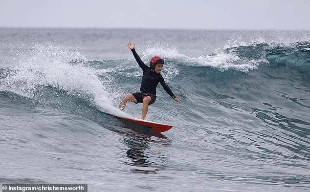 The boys clearly share their father's skills in the ocean.