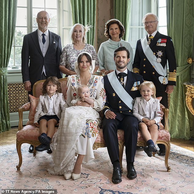 Princess Sofía and her parents, left, and King Carlos Gustaf and Queen Silvia with Prince Carlos Felipe, with Prince Alexander, left, and Prince Gabriel, right, on the day of Prince Julián's christening , hub