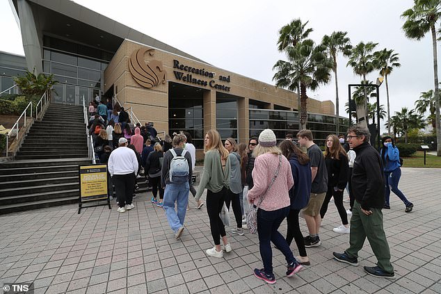 Prospective students and their families take a tour of the University of Central Florida campus this past February.  Governor DeSantis wants state public schools to disclose details about their diversity spending and CRT schemes