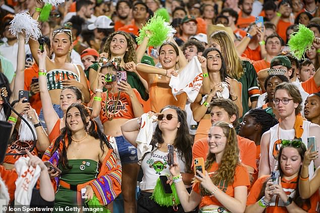 Miami students cheer in the stands during a college football game in November 2022. Governor DeSantis wants to highlight how much money public universities spend on 'diversity' and CRT programs