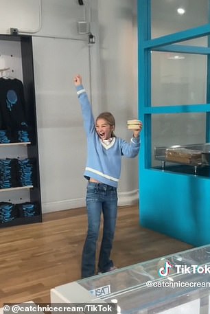 A boy trying to catch his ice cream in the store in New York