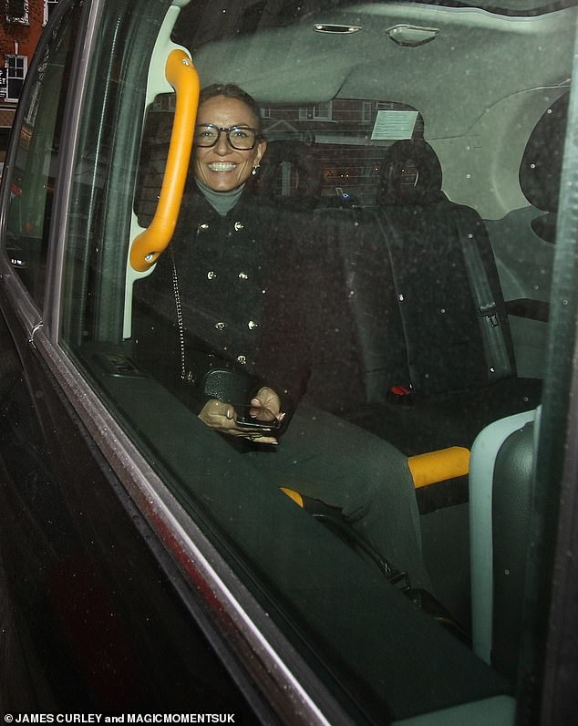 Local time: The presenter headed off in a black cab, an extra smile as she left