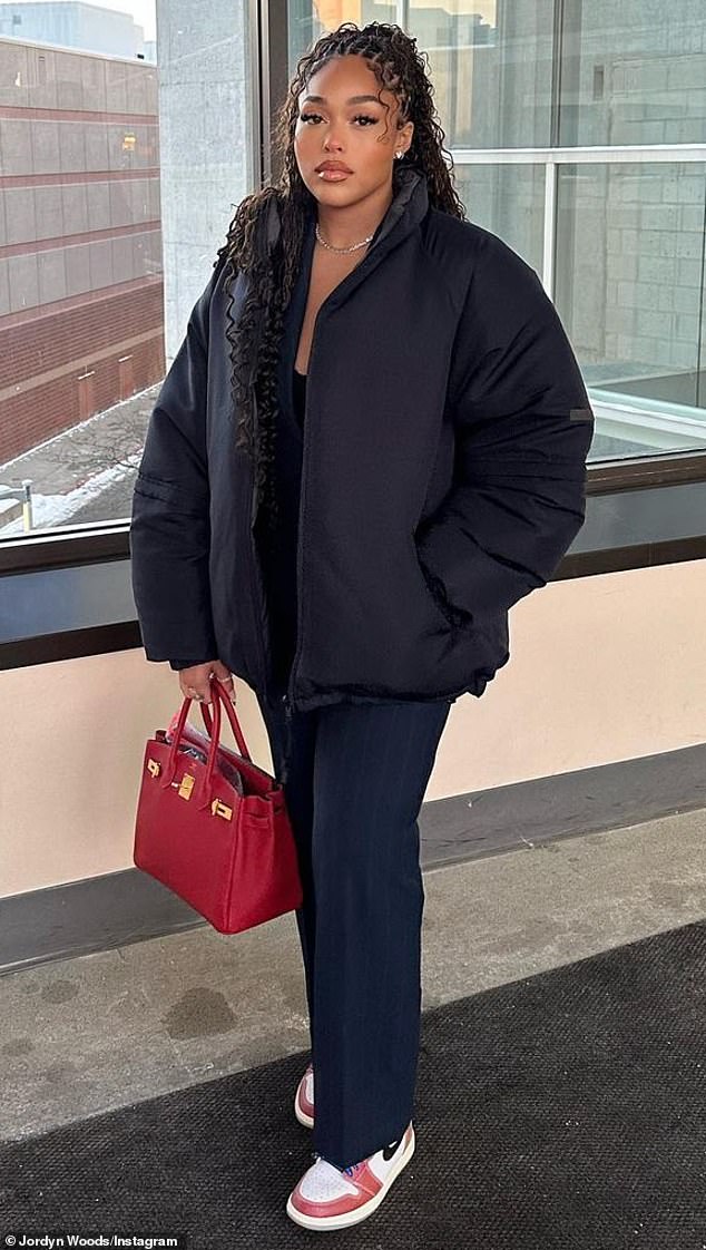 Post-Christmas shopping: The Los Angeles native held on to her Hermes Birkin bag while striking another pose