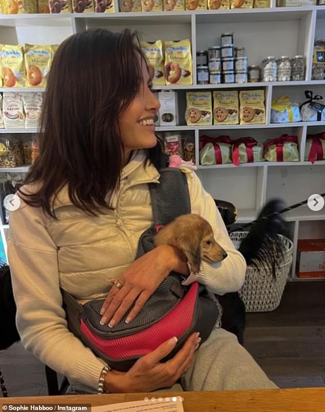 Adorable: a lovesick Sarah enjoyed sitting with Bobbie in a cafe for another part of their day together on Saturday.