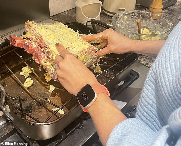 Following Brooklyn's instructions, Ellen massaged the butter mixture into the meat until it was completely covered.