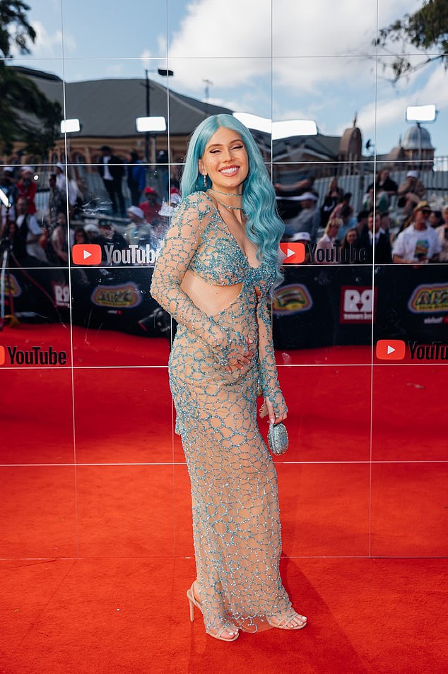 The bubbly 30-year-old woman pictured in this year's ARIAS photo was supposed to tell a group of friends the happy news of her pregnancy when she lost the baby.