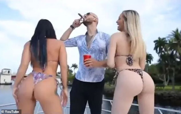 Tate (center), 36, boasted in the YouTube video of his apparent playboy lifestyle, showing him surrounded by bikini-clad young women, hopping on private jets and smoking cigars.