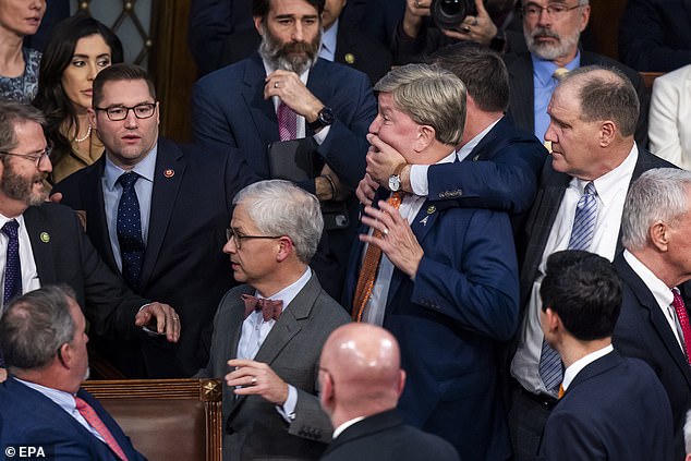 Rep. Mike Rogers of Alabama is pinned down after yelling at Matt Gaetz of Florida