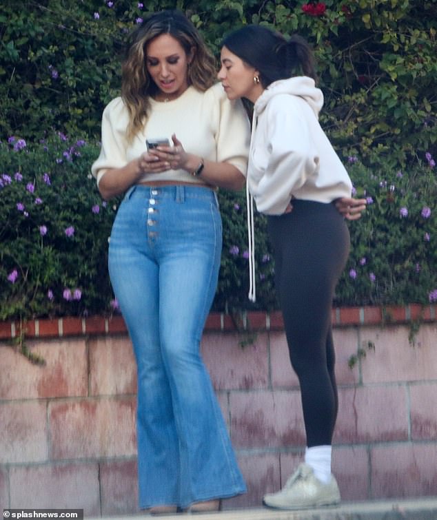 Friend Query: Cheryl caught up with a friend and the two spent some time looking at the Dance Moms star's phone together, before Cheryl got in her car and drove off.