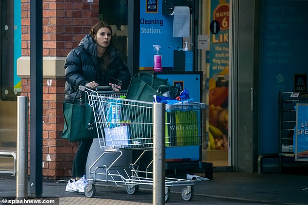 Home time: She let her brown locks fall past her shoulders and she carried her phone in her hands.