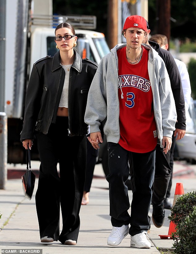 Cute: The happy couple, who got married in 2018, were seen walking towards the restaurant while holding hands