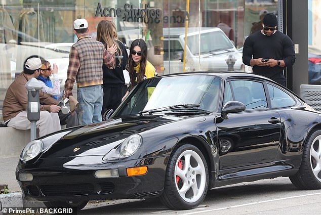 Ready to go: Kendall was later seen pulling up to his sleek black Porsche after enjoying brunch