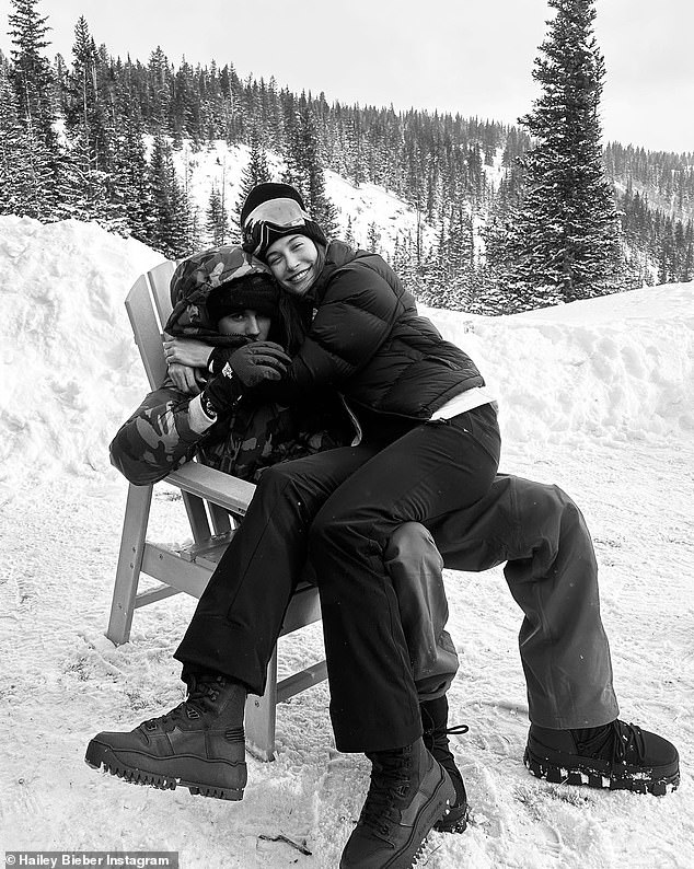 Special memories: Hailey also shared an adorable black and white photo of herself posing for a photo with Justin near a slope while sitting on his lap