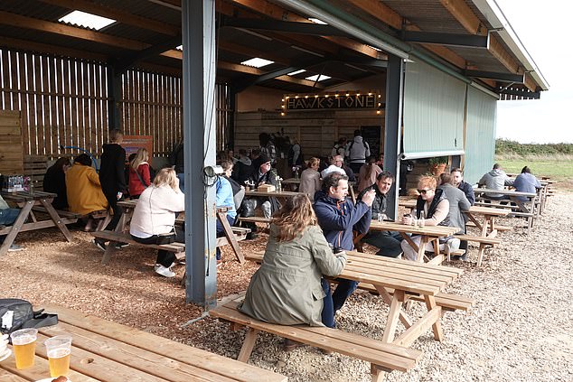 Clarkson, 62, saw the restaurant temporarily closed for a short period last year amid complaints from 'zealous locals' whom he called the 'red pants brigade' and a dispute over planning permission (picture shown). Diddly Squat farm shop and cafe)