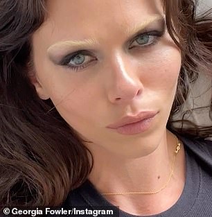 In the short clip, the blue-eyed brunette was filmed lying on the bed looking at the camera as it slowly zoomed in on her face (pictured)