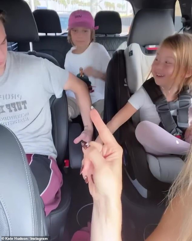 All her children: She said she was a happy mother with her three children in the car, including her middle son, Bingham, 11 (Bingham in the back seat)