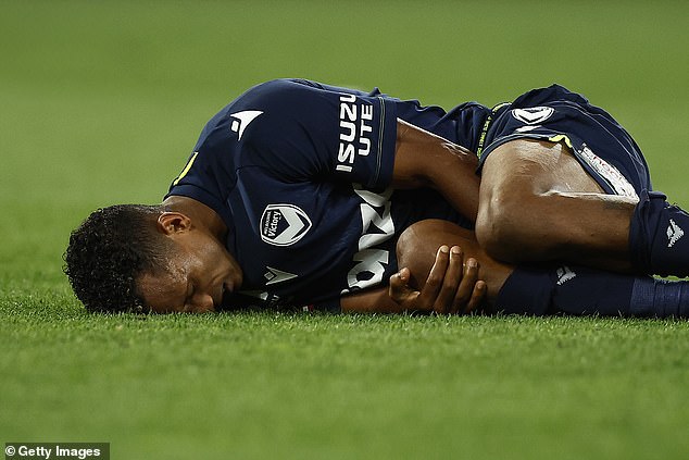 Nani lies dejected and sore on the grass at AAMI Park after suffering a season-ending knee injury.