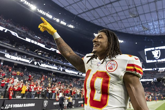 Chiefs running back Isiah Pacheco waves to the crowd after his team's fifth straight win