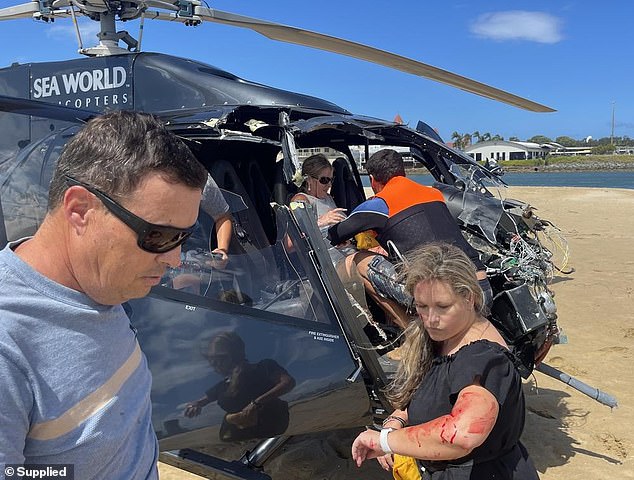 Good Samaritans can be seen helping survivors get out of the helicopter on January 2.