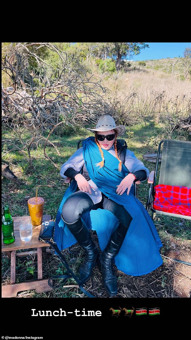 Lounging around: Madonna also shared several photos on her Instagram story, including one in which she was wearing a long blue garment and a large safari hat while relaxing in a chair