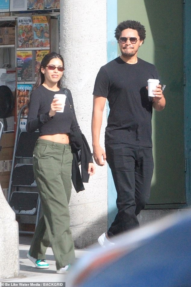 Casual outfit: The former Daily Show host, 38, wore a black outfit with white sneakers while having coffee with a friend