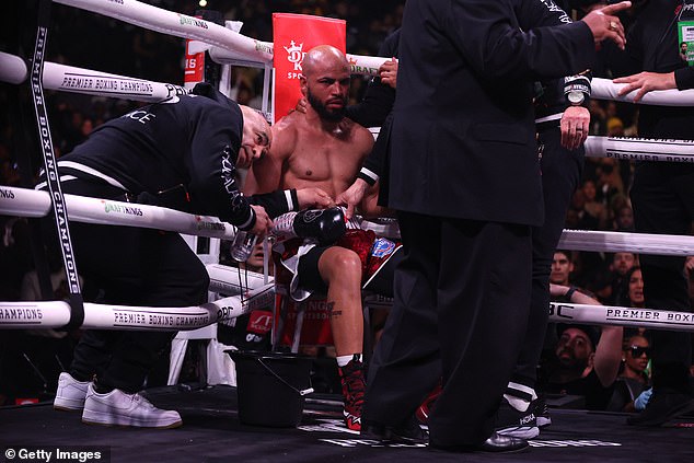 Garcia told his corner that he couldn't see and did not return for the ninth round against Davis.