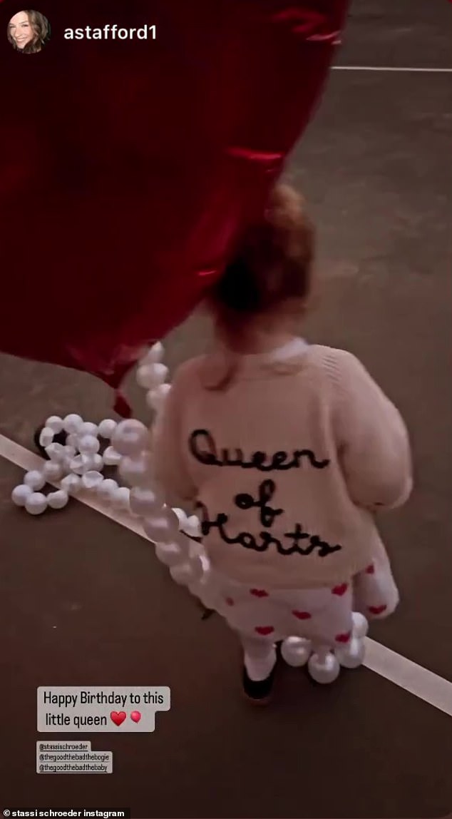 The Queen: Hartford declared that she is the 'Queen of Hearts' by wearing a cute white sweater with her red heart dress and black shoes.