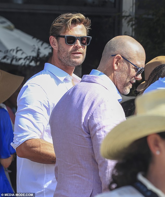 Mike was photographed alongside Elsa's husband, Chris Hemsworth, who was wearing a crisp white shirt.