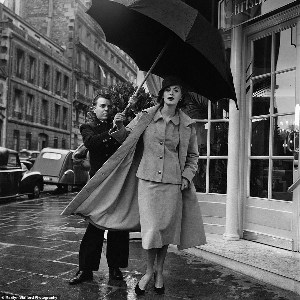 Dior model and umbrella by Marilyn Stafford: Ready-to-Wear, Christian Dior Boutique, Paris, 1950