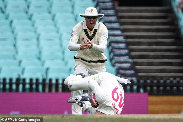 Smith (below) was denied a seemingly perfect catch as he appeared to have knocked out Dean Elgar on day four only for the TV referee to rule the ball had touched the grass.