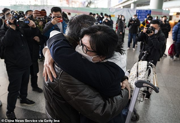 Families were finally reunited as China lifted quarantine requirements for incoming travelers, ending nearly three years of self-imposed isolation even as the country battles a spike in Covid cases.