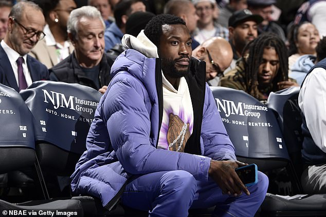 Meek Mill, pictured at a 76ers game in December, was finally calmed down by others