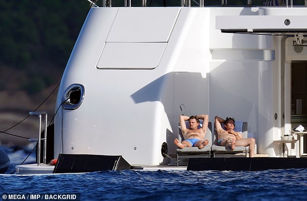 Friends: Leo finished off his tan from the back of a massive $150 million yacht while out at sea with his best friend, actor-musician Lukas Haas (pictured in St Barts in January 2022)