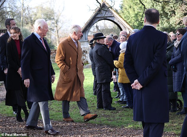 Wearing a brown coat, the King looked relaxed as he was escorted to duty at his royal estate in Norfolk.